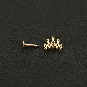 Detailed macro of gold crown stud with clear zircon and screw flat back post