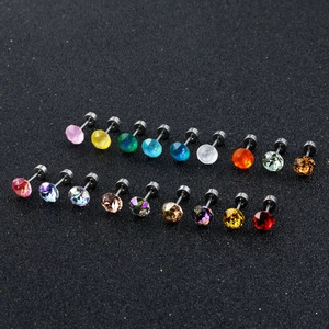 Sparkling crystal stud earrings set with multiple vibrant colors on black glitter background