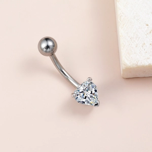 Detail view of heart-shaped cubic zirconia belly ring with silver stainless steel setting