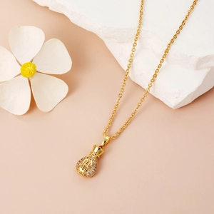 Luxury gold dollar money bag pendant necklace with micro-paved zircons on a white stone