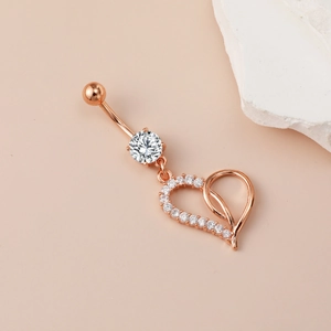 Rose gold heart belly button ring with sparkling zircon stones and a curved barbell design