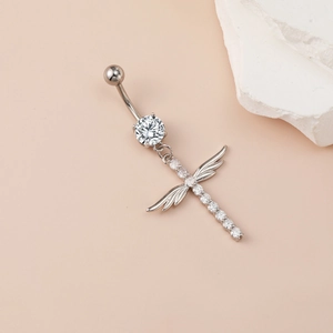 Polished silver belly button ring featuring a crystal cross with angel wings pendant