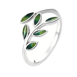 Nature-inspired silver ring featuring green enamel leaves in a minimalist branch design