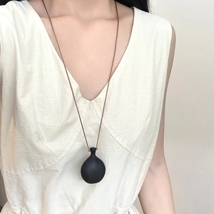 Vintage sandalwood gourd pendant necklace with long cord on model for women