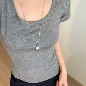 Silver spoon pendant necklace with adjustable ball chain on model for casual styling