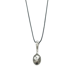 Minimalist silver spoon pendant necklace with adjustable black cord on white background