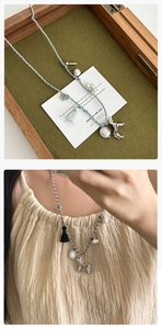 Vue détaillée du collier en corde tressée avec pendentif chien, perles et glands