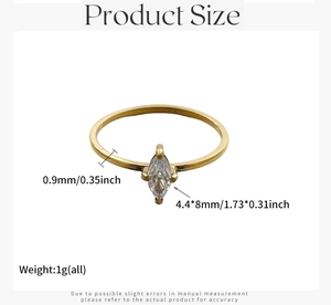 Detalle de circón corte marquesa en anillo minimalista de acero bañado en oro de 0,9 mm