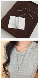 Adjustable heart necklace featuring hammered texture pendant and sleek silver bead chain