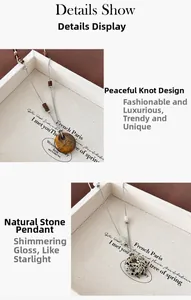 Detailweergave van natuursteen Ping'an gesp hangers met tijgeroog en gevlekte steen