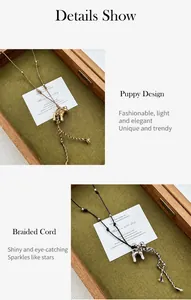 Detailed view of dog pendants with woven rope chain in gold and silver finish