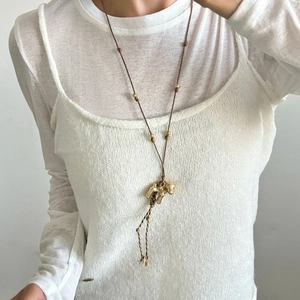 Minimalist puppy tassel pendant long necklace with brown rope and gold beaded accents