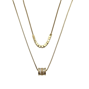 Dubbellaagse titaniumstalen ketting met gouden kubussen en fonkelende cilinderhanger