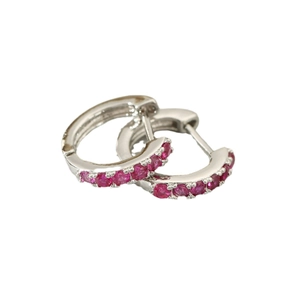 Silver hoop earrings with sparkling red zircon pavé setting and secure clasp closure