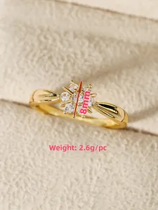 Vista macro de anillo floral de 8mm con cristales y etiqueta de peso de 2,6g en tela