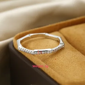 Octagonal silver diamond ring with 2mm width and 2g weight on luxury velvet jewelry box