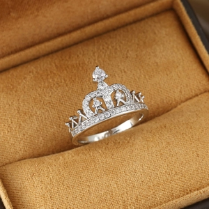 Elegant silver crown ring with sparkling zircons set in a soft velvet jewelry box