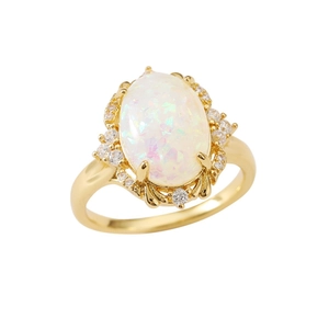 Elegant vintage oval opal ring with golden halo and sparkling white side stones
