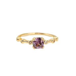 Elegant gold-plated ring with a square purple gem and sparkling side micro-diamonds