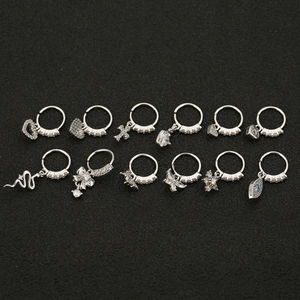 Set of 12 silver hip-hop earrings featuring stars hearts and crosses with sparkling zircons