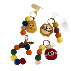 Set of cute handmade felt keychain charms with chick, lion, and cartoon characters