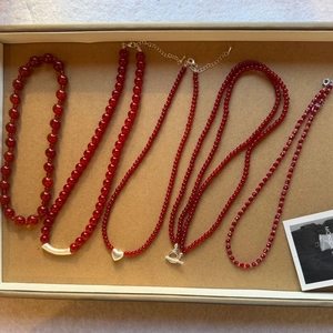 Detailed set of five red agate beaded necklaces featuring silver heart and toggle clasp
