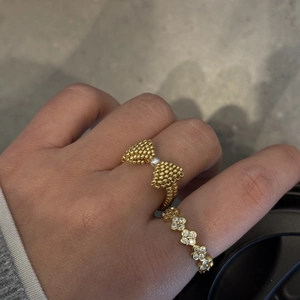 Three-layer gold stacking rings with bow pearl and zircon flower motifs for women