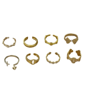 Eight-piece gold fashion ring set featuring butterfly and zircon crystal designs