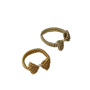 Handmade golden seed bead rings with sweet bow design in minimalist double-layer style