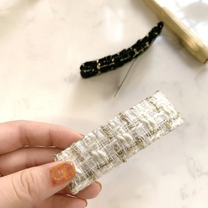 Classic tweed fabric BB hair clips with gold thread details in black and white colors