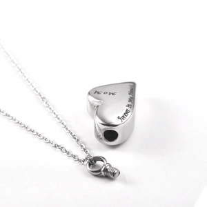 Detail view of Mom heart urn pendant with engraving and screw top opening mechanism