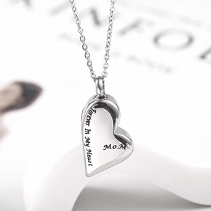 Detailed macro view of heart pendant with 'Forever IN My Heart' side engraving
