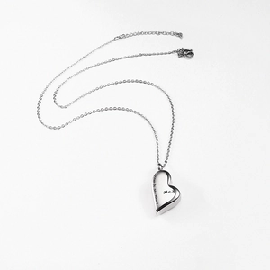Detailed close-up of Mom heart pendant engraved with Forever In My Heart and link chain