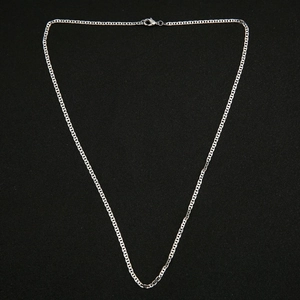 Close-up of silver-toned metal mariner link chain with secure lobster clasp on black background