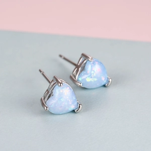 Elegant heart-shaped opal stud earrings in silver minimalist prong setting for women