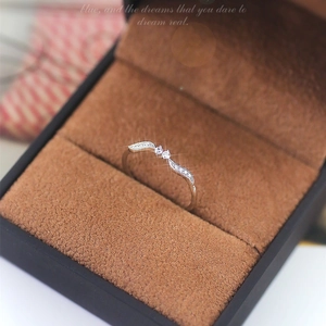 Elegant wave leaf silver ring with diamonds in luxury brown jewelry box showcase