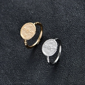 Vintage compass ring in gold and silver finish with engraved N-E-S-W directional letters