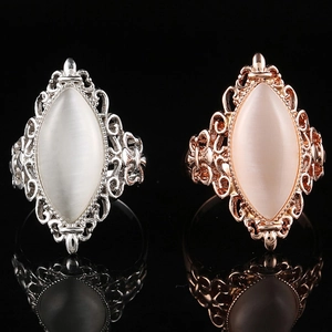 Vintage marquise opal ring with hollow metal design in silver and rose gold finishes
