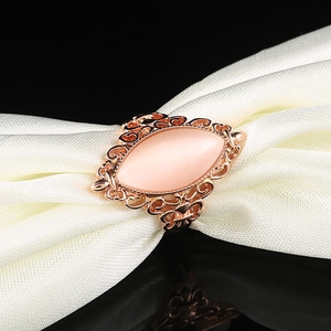 Vintage rose gold ring featuring a marquise cat eye opal stone and hollow patterns