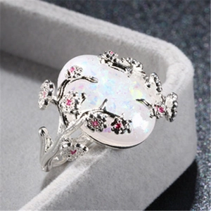 Luxurious vine flower ring with oval opal gemstone and pink crystal accents in silver