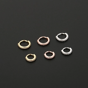 Three pairs of gold, rose gold and silver hinged hoop earrings with pavé cubic zirconia