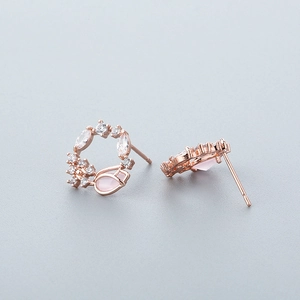 Exquisite rose gold flower earrings featuring pink teardrop crystals and white zircons