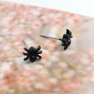 Minimalist black spider stud earrings with rhinestones for a punk Halloween style