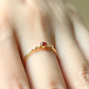 Elegant copper gold plated ring with a round ruby center and four-claw setting