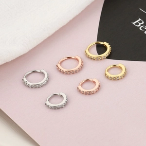 Copper cartilage hoops set with micro-pave zircons in silver, gold, and rose gold finish