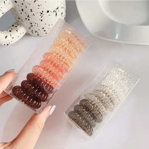 Elastic spiral hair ties set in clear storage box with neutral and warm colors