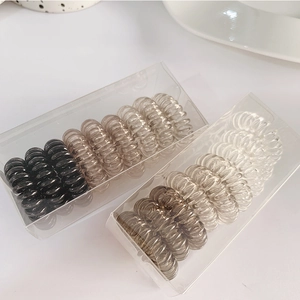 Elastic spiral hair ties set in assorted earth tones including black and clear colors
