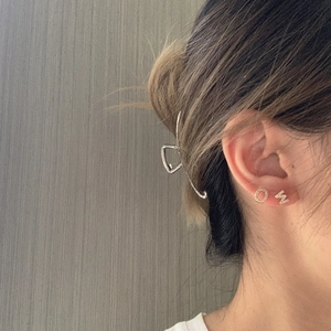 Asymmetric 925 silver letter O and M earrings with micro-set zircons on female model