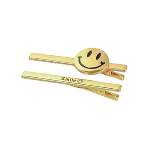 Minimalist gold metal smile face hair clips set with duckbill design for women
