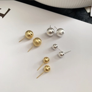 Brushed 925 silver needle sphere stud earrings in textured gold and silver finishes